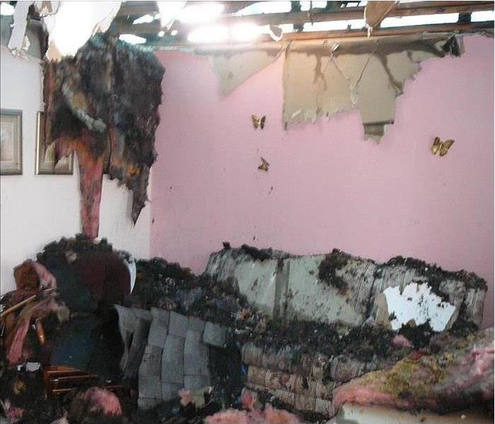 fire damaged room with caved in ceiling 